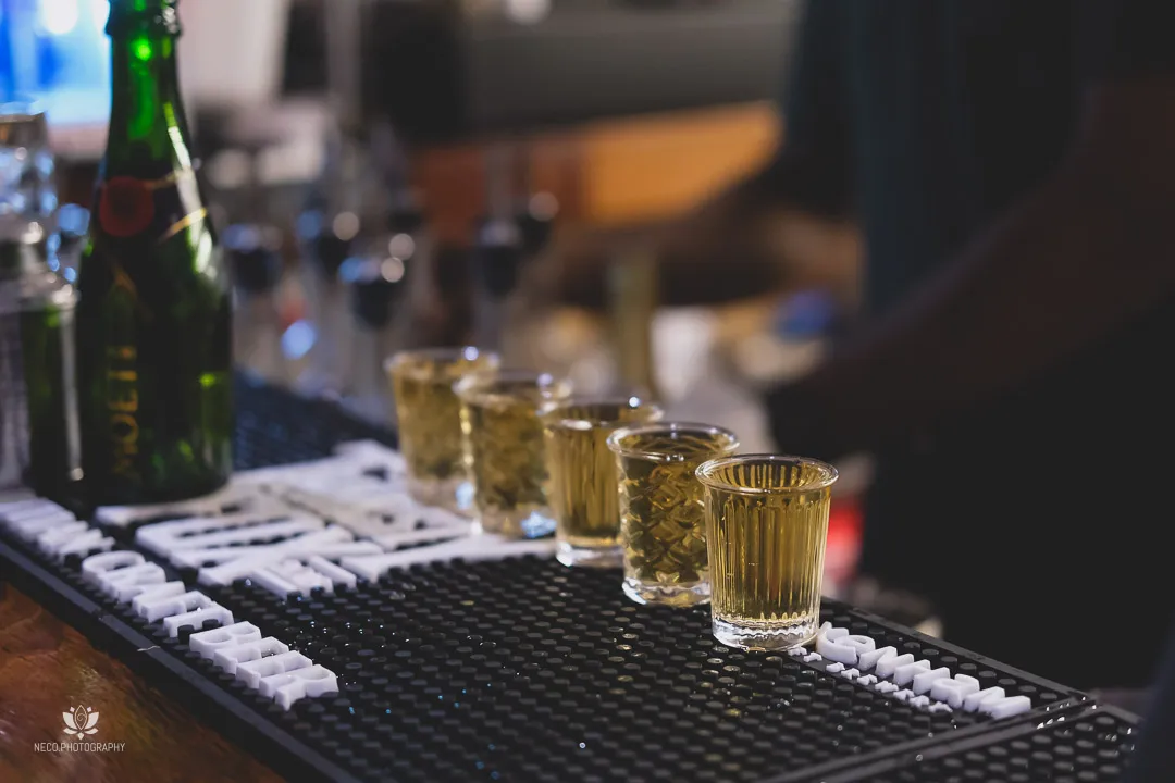 Shooters lined along the bar mat